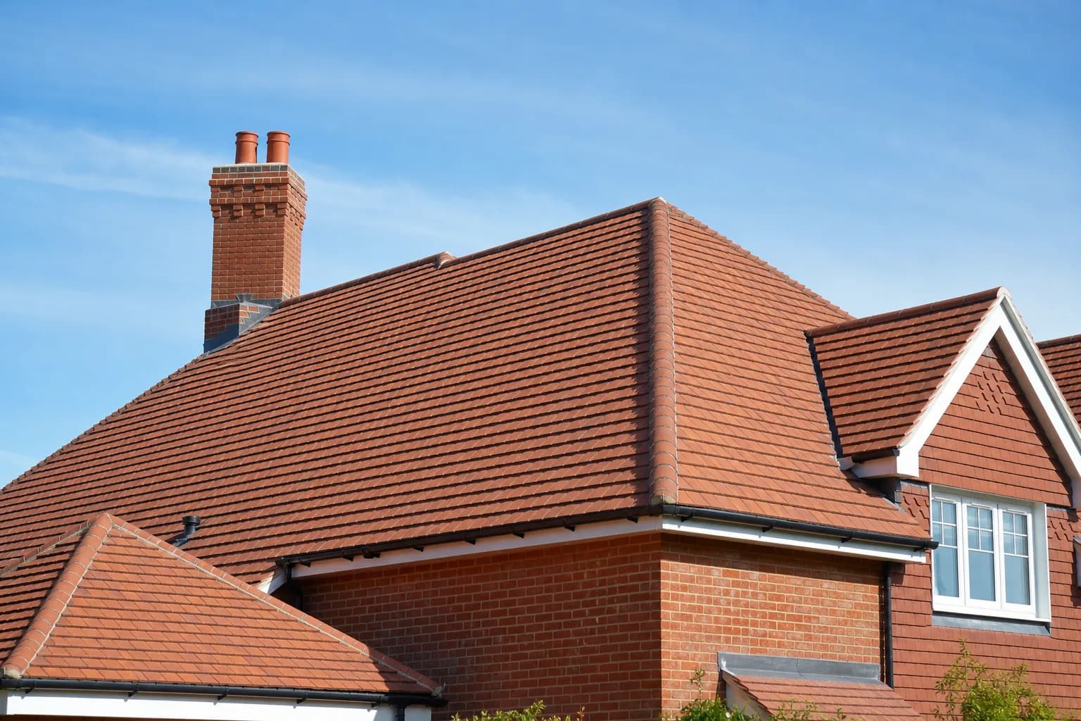 Professional roofer working on a residential roof in the West Midlands